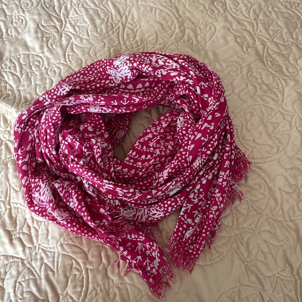 Pink scarf with batik style prints in white, subtle fringe at ends